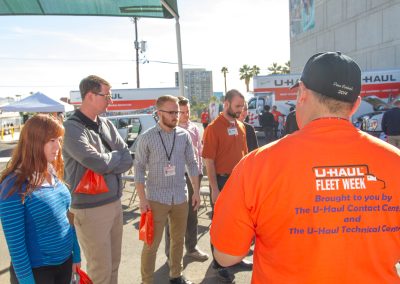 U-Haul employees viewing a Fleet Week demonstration.