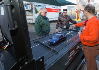 Two people viewing a safe trailering demonstration.