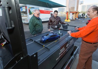 Two people viewing a safe trailering demonstration.