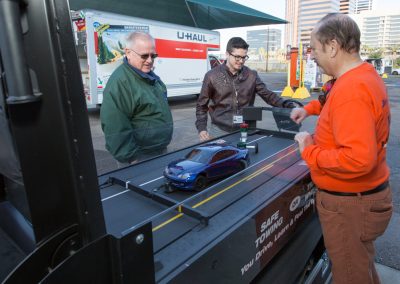 Two people viewing a safe trailering demonstration.