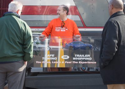 Two people viewing a safe trailering demonstration.