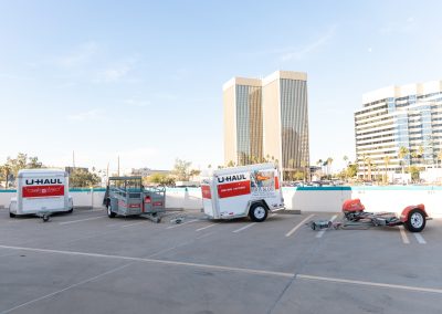 Different types of U-Haul trailers on display.