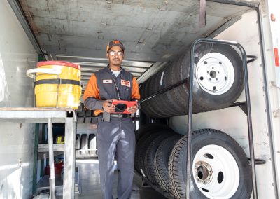 Man standing in the back of a U-Haul truck.