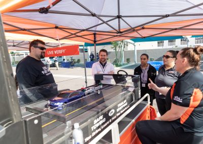 U-Haul employees viewing a Fleet Week demonstration.